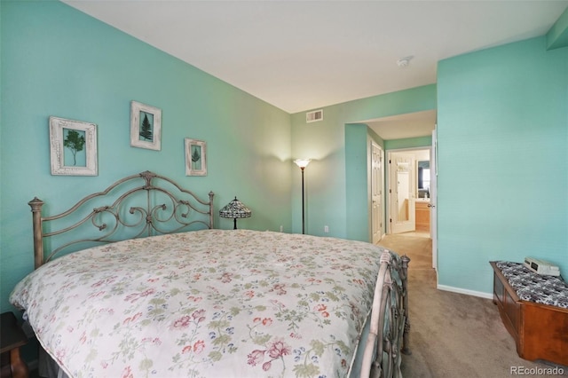 carpeted bedroom featuring baseboards