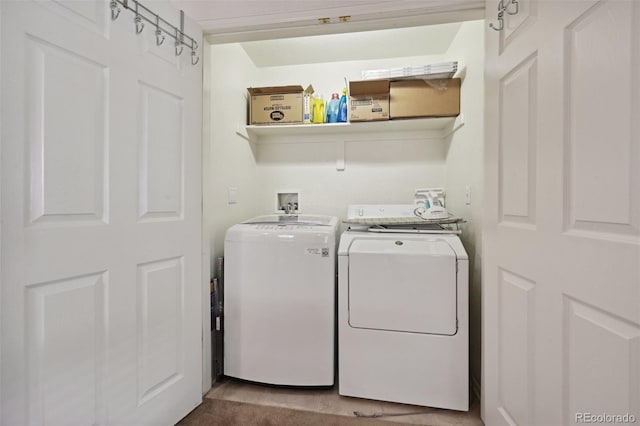 clothes washing area featuring independent washer and dryer