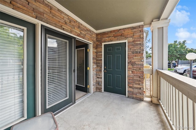 property entrance featuring stone siding