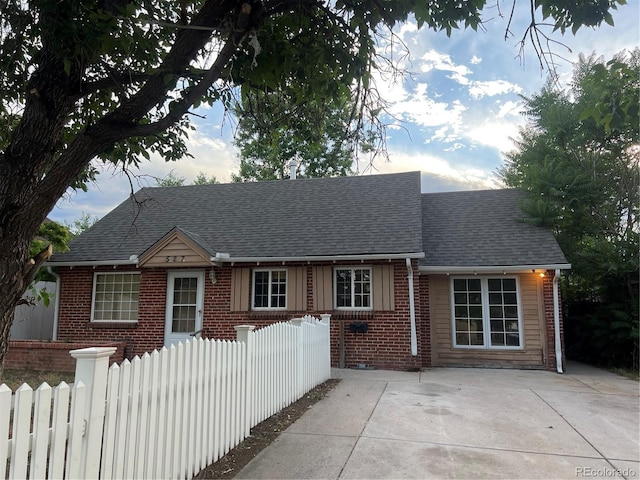 527 S Bryant St, Denver, CO 80219 - view of front of house with brick siding and roof with shingles