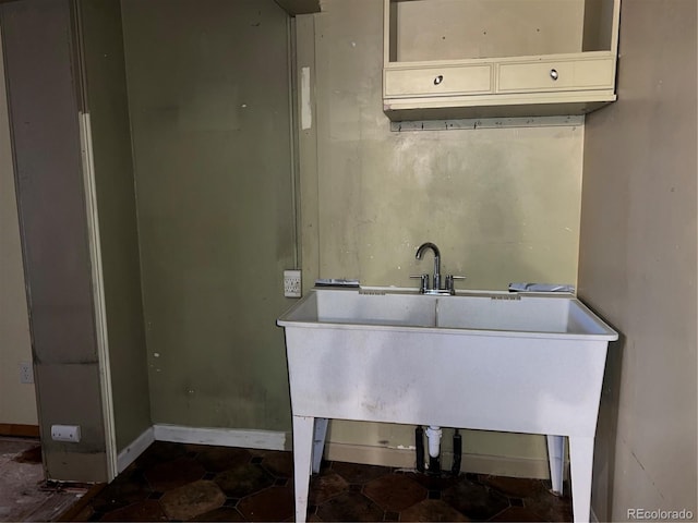 527 S Bryant St, Denver, CO 80219 - bathroom featuring baseboards