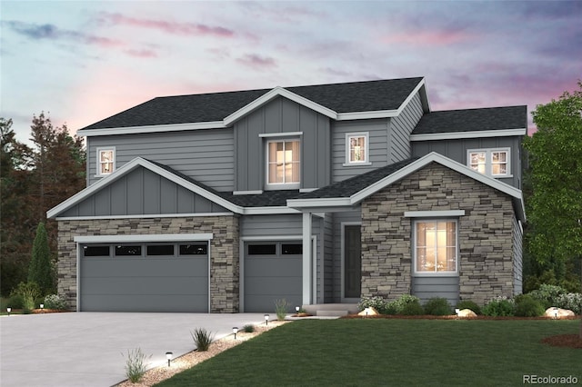 view of front of home featuring a lawn and a garage