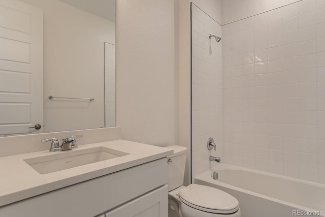 bathroom with vanity, shower / bathing tub combination, and toilet