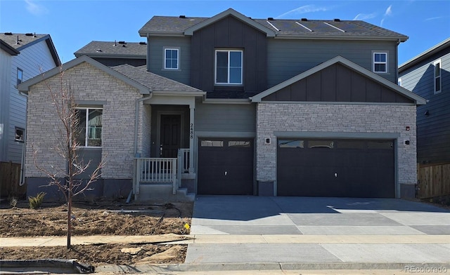 view of front of home with brick siding, board and batten siding, an attached garage, and driveway