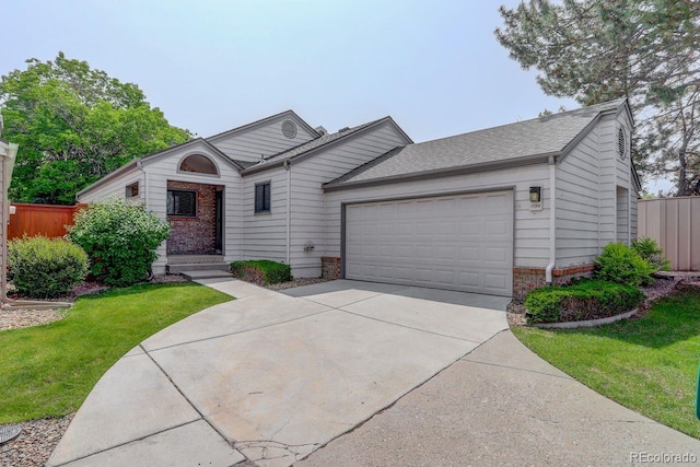 11186 E Baltic Dr, Aurora, CO 80014 - single story home featuring an attached garage, brick siding, and driveway