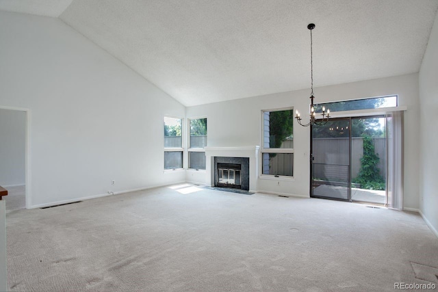 11186 E Baltic Dr, Aurora, CO 80014 - unfurnished living room with a chandelier, a fireplace with flush hearth, carpet floors, high vaulted ceiling, and a textured ceiling