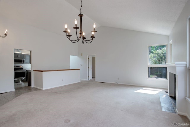 11186 E Baltic Dr, Aurora, CO 80014 - unfurnished living room with a chandelier, high vaulted ceiling, carpet flooring, and baseboards