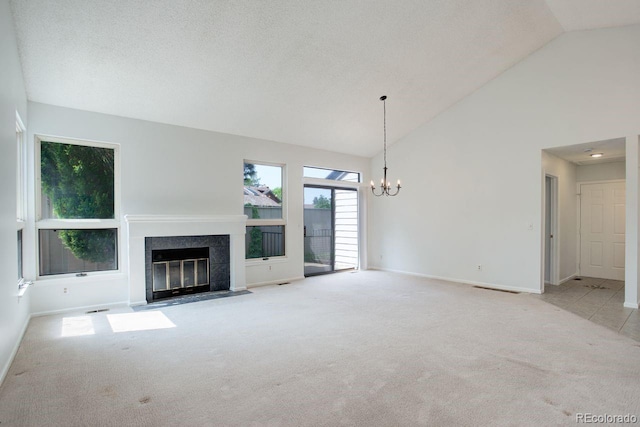 11186 E Baltic Dr, Aurora, CO 80014 - unfurnished living room featuring carpet flooring, a fireplace with flush hearth, a chandelier, high vaulted ceiling, and baseboards