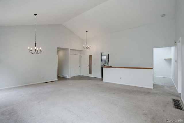 11186 E Baltic Dr, Aurora, CO 80014 - carpeted empty room featuring a chandelier, high vaulted ceiling, and baseboards