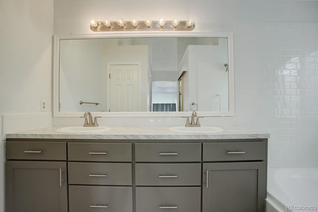 11186 E Baltic Dr, Aurora, CO 80014 - full bathroom featuring double vanity and a tub to relax in