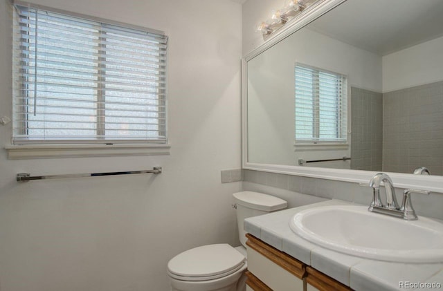 11186 E Baltic Dr, Aurora, CO 80014 - bathroom featuring vanity, healthy amount of natural light, and toilet