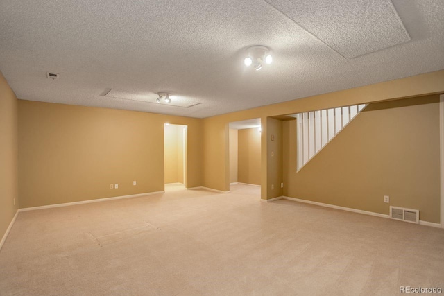 11186 E Baltic Dr, Aurora, CO 80014 - spare room with light colored carpet, baseboards, and a textured ceiling