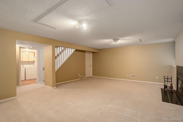 11186 E Baltic Dr, Aurora, CO 80014 - finished basement with washer and clothes dryer, a textured ceiling, stairway, carpet floors, and baseboards