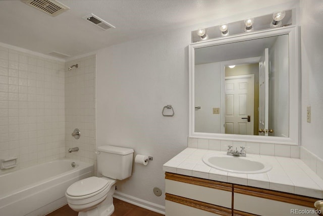 11186 E Baltic Dr, Aurora, CO 80014 - bathroom with toilet, vanity, bathing tub / shower combination, and baseboards