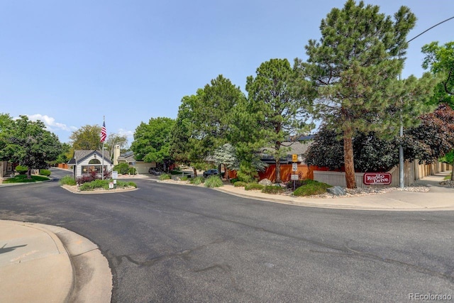 11186 E Baltic Dr, Aurora, CO 80014 - view of asphalt street featuring curbs and sidewalks