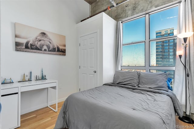 2020 Arapahoe St Unit 1250, Denver, CO 80205 - bedroom featuring wood finished floors