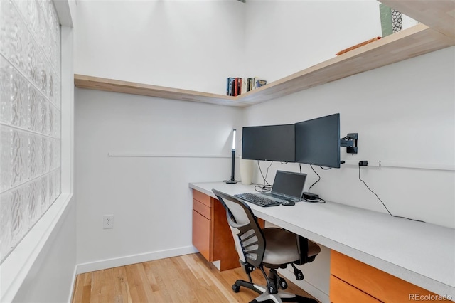 2020 Arapahoe St Unit 1250, Denver, CO 80205 - home office with baseboards and light wood-style floors