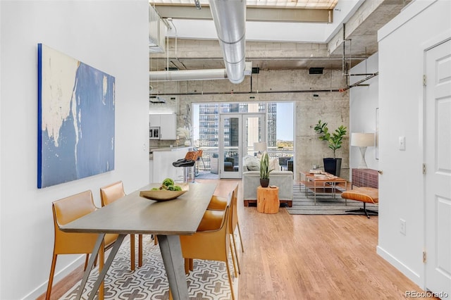 2020 Arapahoe St Unit 1250, Denver, CO 80205 - dining space with wood finished floors and baseboards