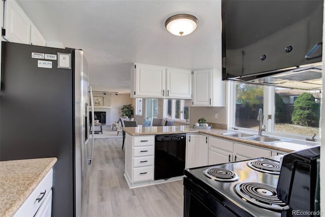 kitchen with stainless steel fridge, dishwasher, white cabinets, and light hardwood / wood-style floors