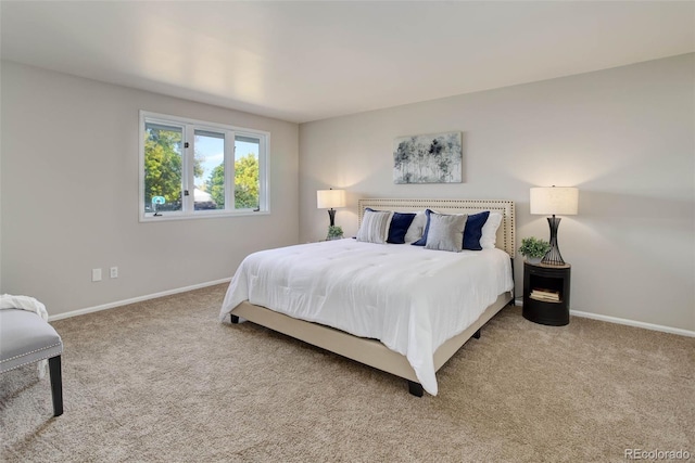 bedroom featuring light colored carpet