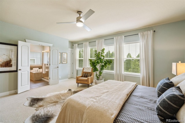 817 Uinta Way, Denver, CO 80230 - bedroom with light colored carpet, baseboards, ceiling fan, and connected bathroom