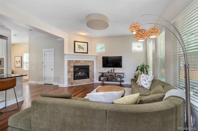 817 Uinta Way, Denver, CO 80230 - living room featuring dark wood finished floors, a fireplace, and baseboards