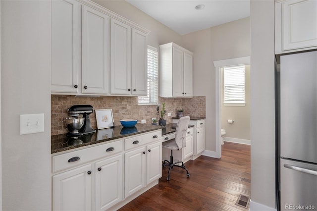 817 Uinta Way, Denver, CO 80230 - kitchen featuring stainless steel refrigerator, tasteful backsplash, healthy amount of natural light, and dark wood-style floors