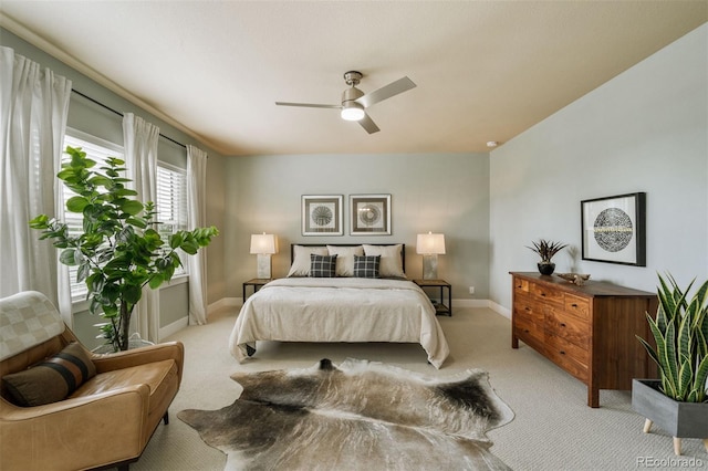 817 Uinta Way, Denver, CO 80230 - bedroom with light carpet, baseboards, and ceiling fan