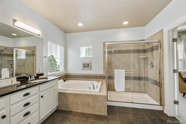 817 Uinta Way, Denver, CO 80230 - bathroom featuring vanity, a bath, a shower stall, and recessed lighting