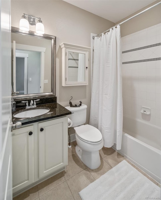817 Uinta Way, Denver, CO 80230 - bathroom with toilet, shower / bath combo with shower curtain, vanity, and tile patterned floors