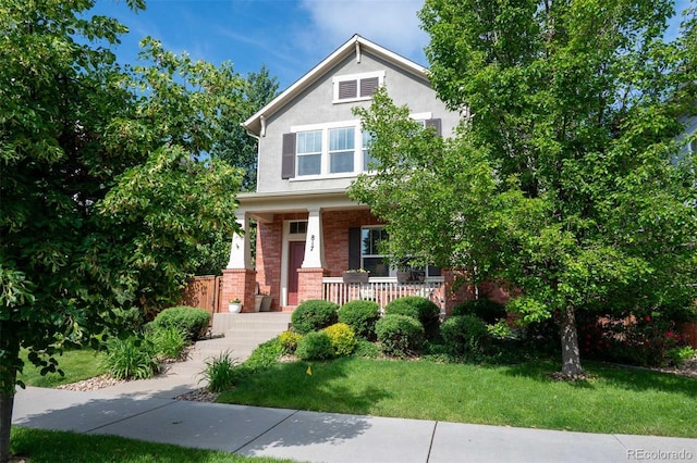 817 Uinta Way, Denver, CO 80230 - view of front of property featuring a porch, brick siding, a front yard, and stucco siding