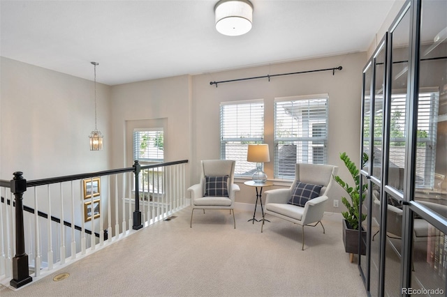 817 Uinta Way, Denver, CO 80230 - living area featuring carpet flooring and an upstairs landing