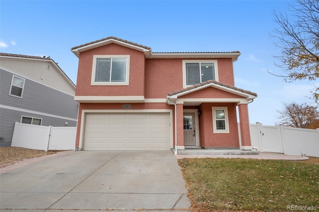 view of front of house with an attached garage, stucco siding, concrete driveway, and a tile roof