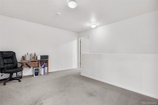 home office featuring carpet and baseboards