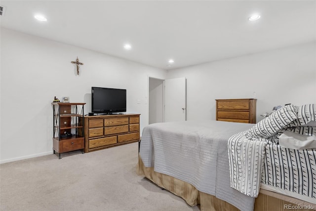 bedroom with light colored carpet, recessed lighting, and baseboards