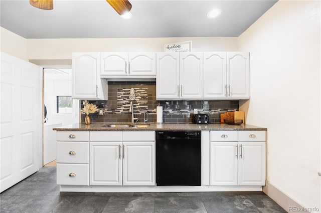 kitchen with tasteful backsplash, dishwasher, a sink, dark stone countertops, and white cabinetry
