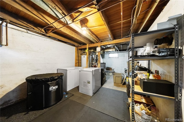 below grade area with gas water heater and refrigerator