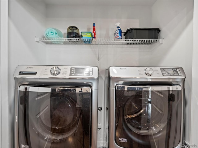 clothes washing area with independent washer and dryer