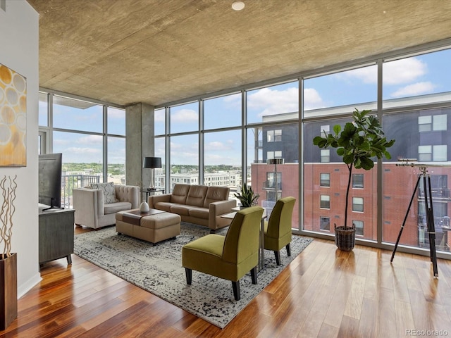 living room with hardwood / wood-style floors and expansive windows