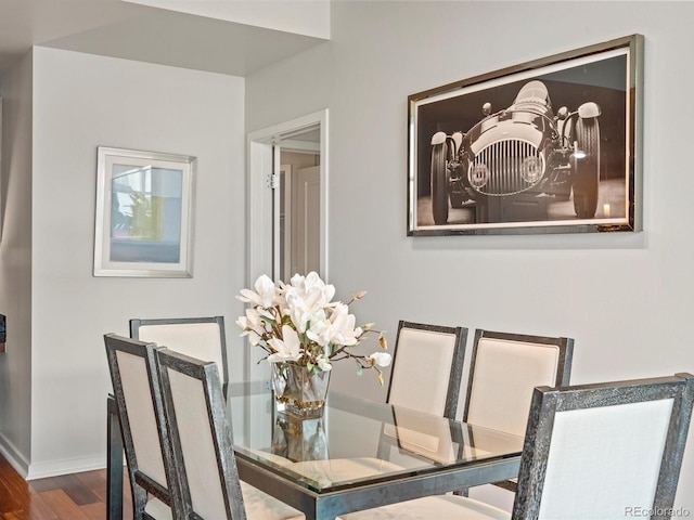 dining space with hardwood / wood-style flooring