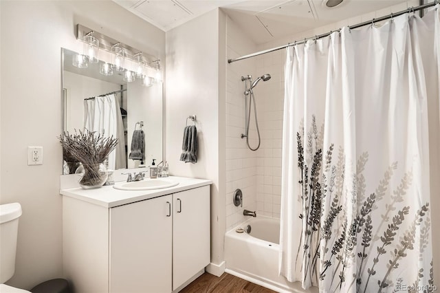 full bathroom featuring toilet, shower / bath combo, wood finished floors, and vanity