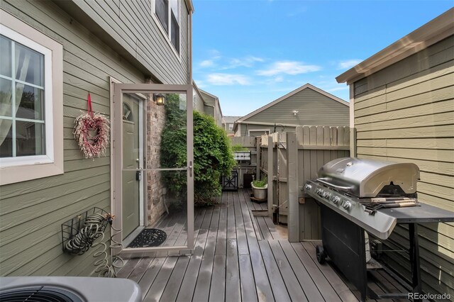 3407 S Ammons St Unit 20-2, Lakewood, CO 80227 - wooden deck with a grill