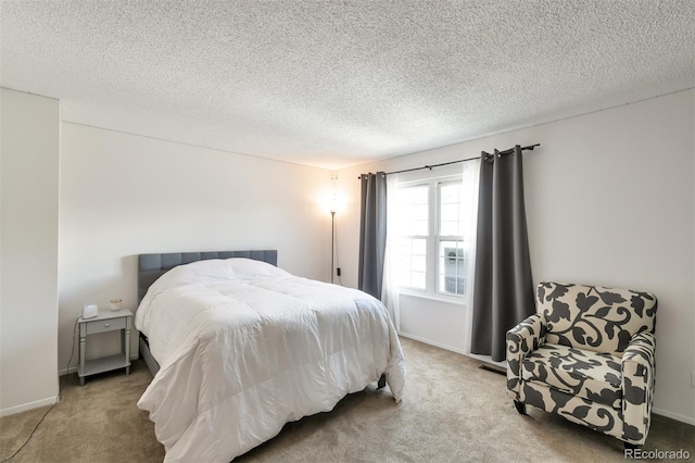 3407 S Ammons St Unit 20-2, Lakewood, CO 80227 - bedroom featuring carpet floors, a textured ceiling, and baseboards
