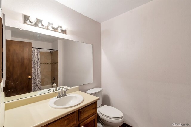 3407 S Ammons St Unit 20-2, Lakewood, CO 80227 - bathroom with toilet, vanity, and a shower with shower curtain