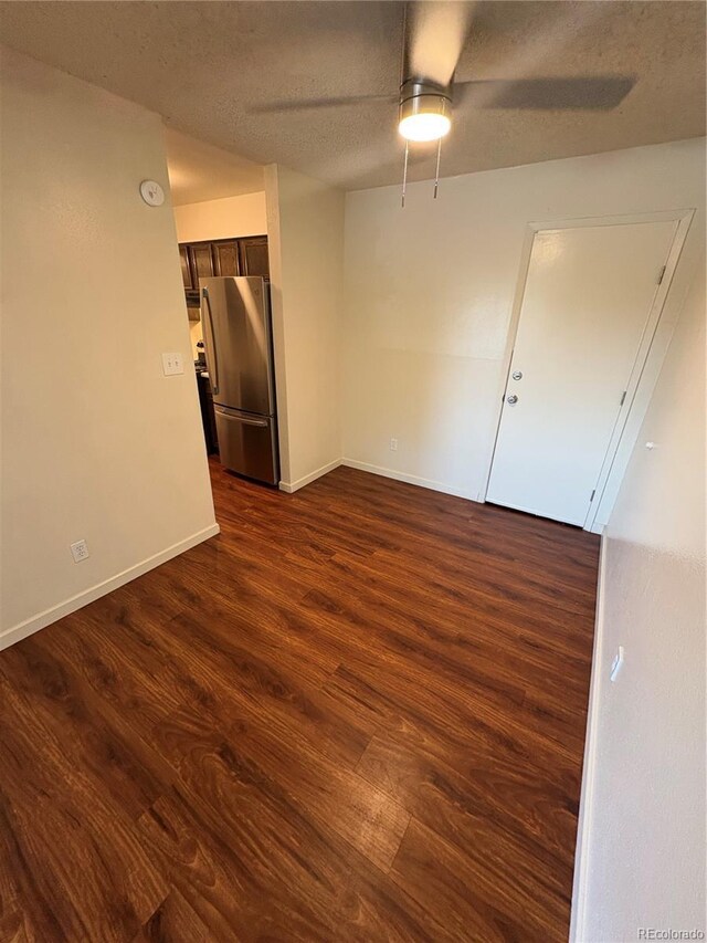 6905 Mariposa St Unit B, Denver, CO 80221 - unfurnished room featuring a ceiling fan, dark wood finished floors, a textured ceiling, and a smoke detector