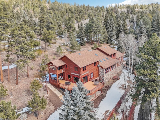 birds eye view of property featuring a view of trees