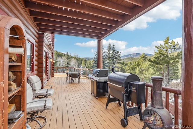 deck featuring a mountain view and area for grilling