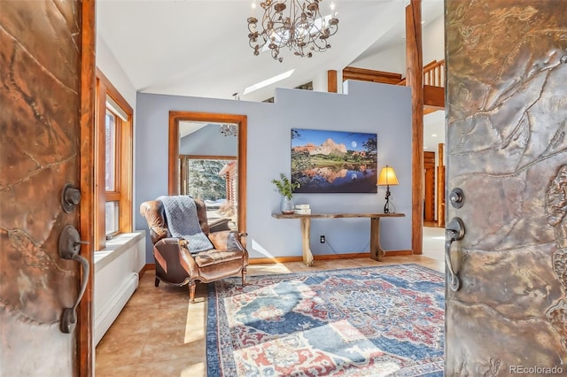 living area with a chandelier, light tile patterned flooring, a baseboard heating unit, baseboards, and vaulted ceiling