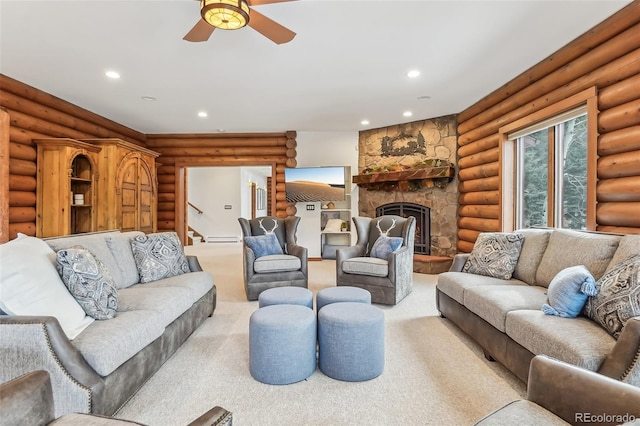 carpeted living area with ceiling fan, recessed lighting, a fireplace, stairs, and log walls