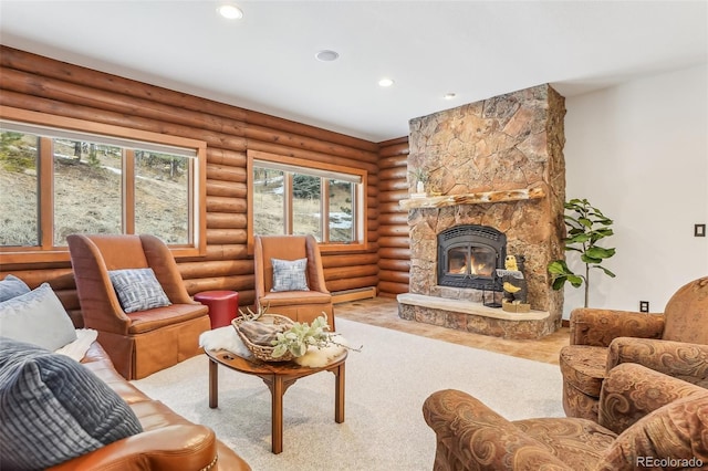 living room featuring rustic walls, a fireplace, and recessed lighting